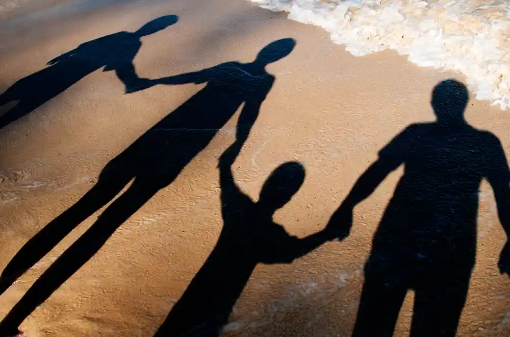 personal financial protection - family walking on beach
