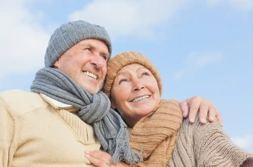 Retirement Financial Planning Investments - Elderly Couple smiling