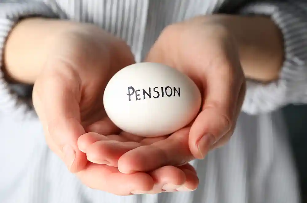 egg with pension on it in hands